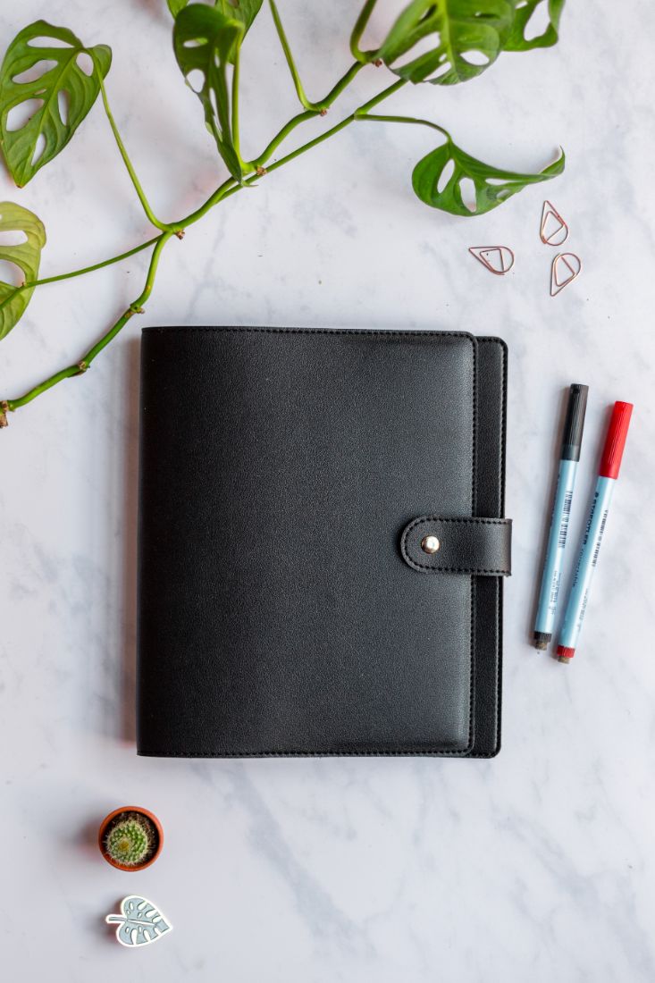 Black, animal-free cover with button for the reusable Asoki Planner
