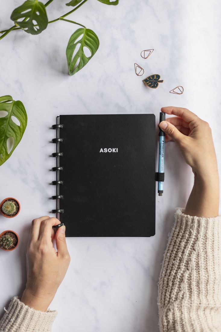 Asoki Planner with a black cover and binding, put your pen into the pen loop
